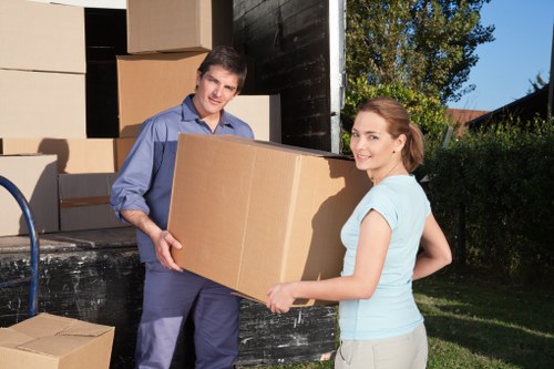 Moving boxes and wrapped furniture in an East London flat